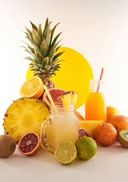 A glass of fruit juice on a white background. Delicious, tasty, fresh, summer set. Sweet, exotic beverage with fruits.
