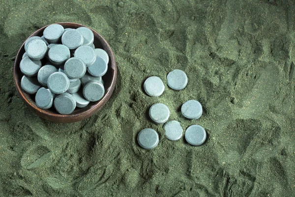 Spirulina algae powder and tablets. Arthrospira platensis