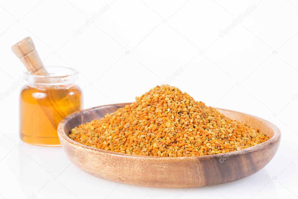 Granulated pollen and honey - white background