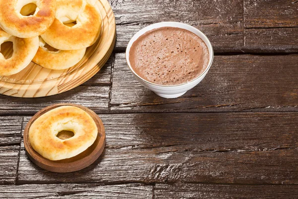 Pandequeso traditional Colombian food - Hot drink chocolate