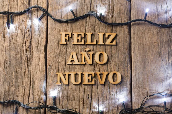 新年あけましておめでとうございます 木製の背景 スペイン語 — ストック写真