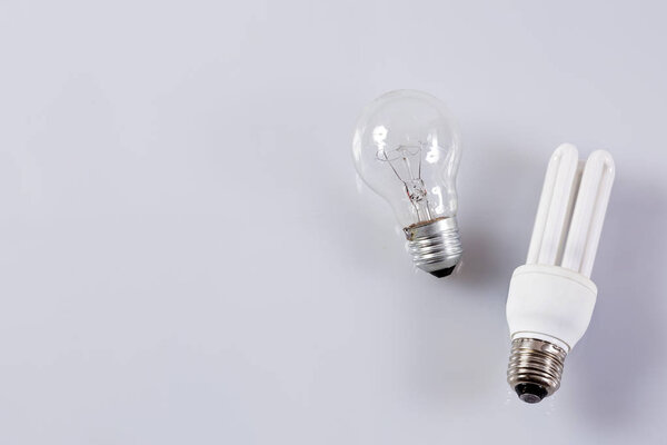 Traditional and energy efficient bulb. White background