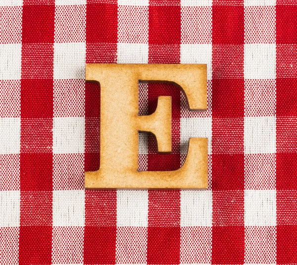 Letter E of the alphabet - Red checkered fabric tablecloth.