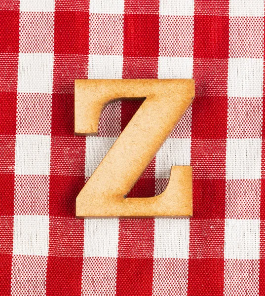 Letter Z of the alphabet - Red checkered fabric tablecloth.