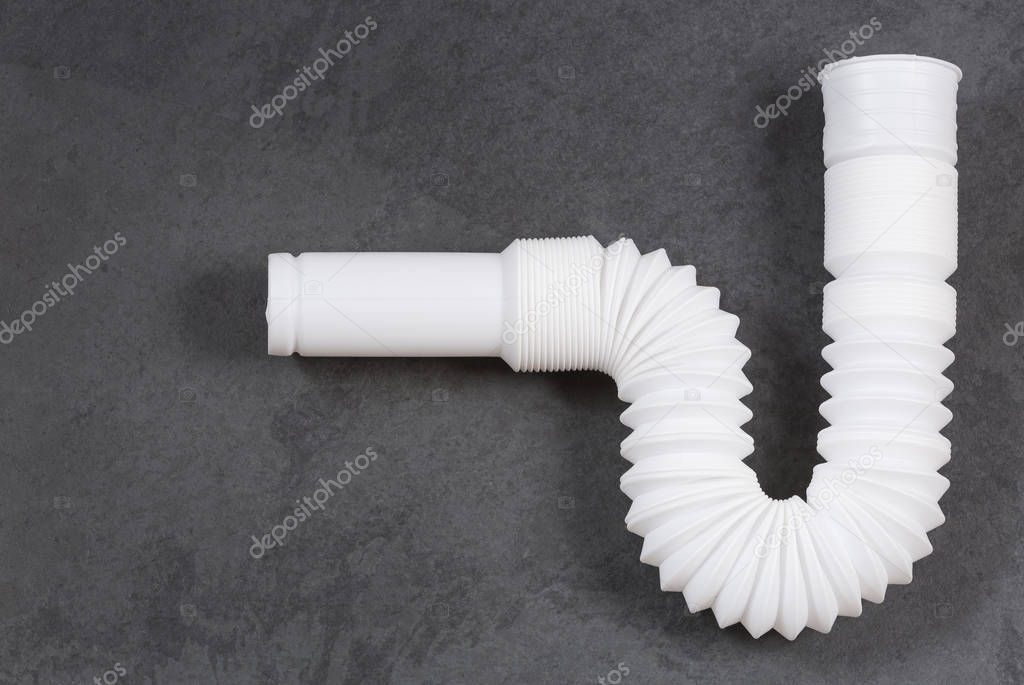 Plastic pipe with water trap, isolated - Plastic flexible siphon. Top view