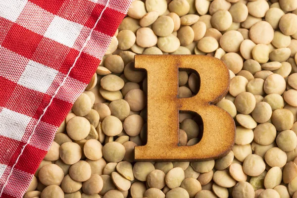Letter B, Lentils with checkered napkin - Top view