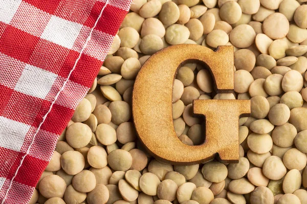 Letter G, Lentils with checkered napkin - Top view