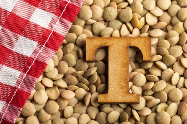 Letter T, Lentils with checkered napkin - Top view