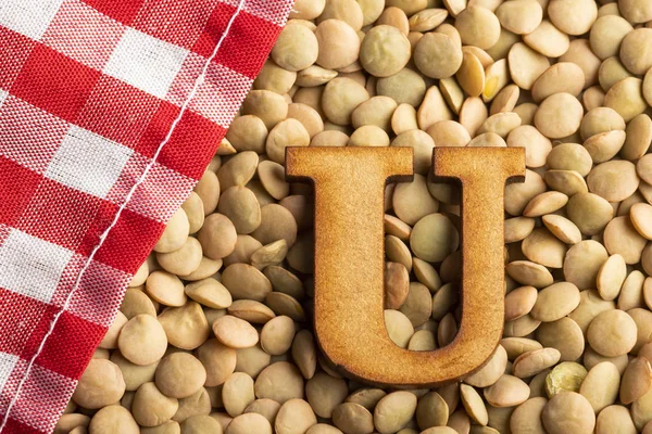 Letter U, Lentils with checkered napkin - Top view