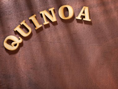Ahşap harflerle kelime Quinoa-Chenopodium Quinoa. Metin alanı