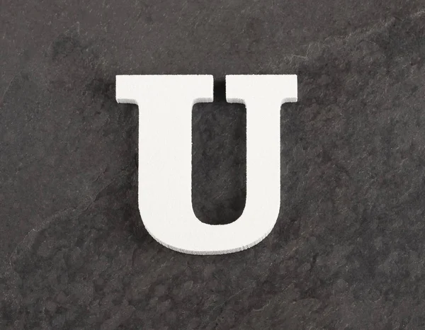 Lettre U de l'alphabet blanc sur fond gris - Vue du dessus — Photo
