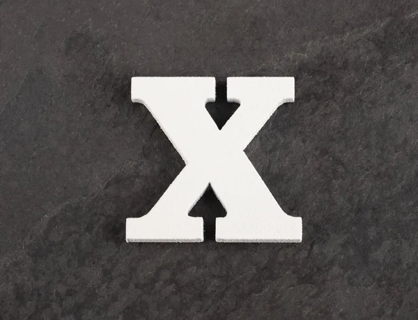 Letter X from blank alphabet on gray background - Top view — Stock Photo, Image