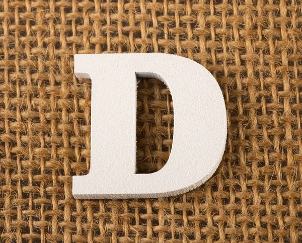 D, písmeno abecedy - texturu pozadí pytlovina — Stock fotografie