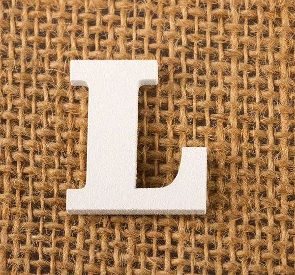 L, γράμμα του αλφαβήτου - λινάτσα υφή φόντου — Φωτογραφία Αρχείου