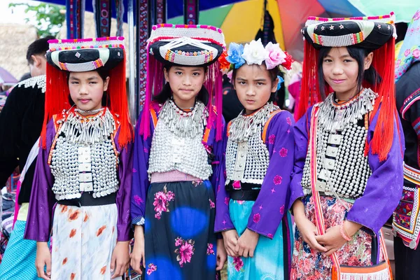 Lisu hill-tribe preteen girl wears traditional tribal attire with black circular Lisu headdress on Akha Swing Festival 2018. — Stock Photo, Image