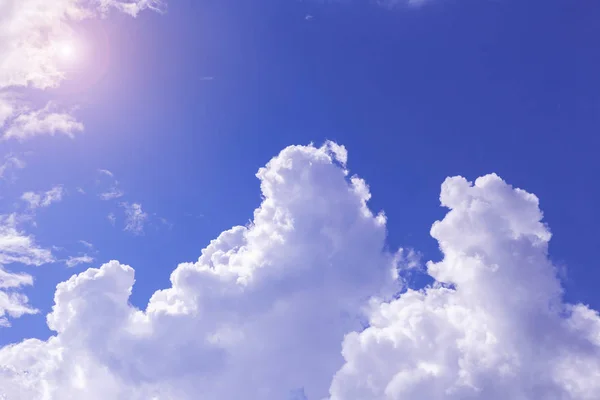 Blue sky and white clouds, rain clouds on sunny summer or spring day.