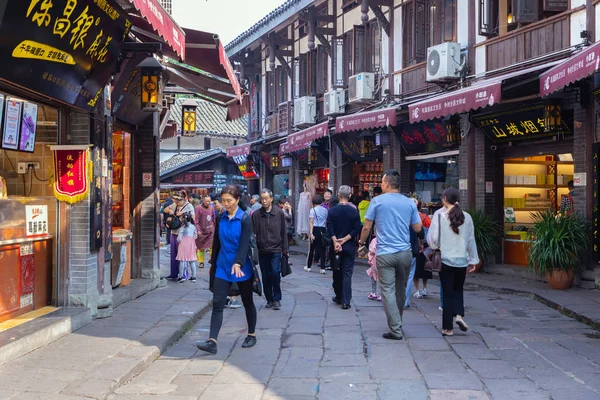 Tourists are walk for shopping in Ciqikou ancient town, a popular travel destination. — Stock Photo, Image