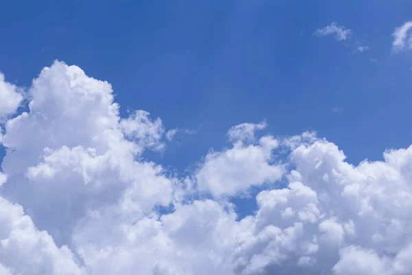 Blue sky and white clouds, rain clouds on sunny summer or spring day.