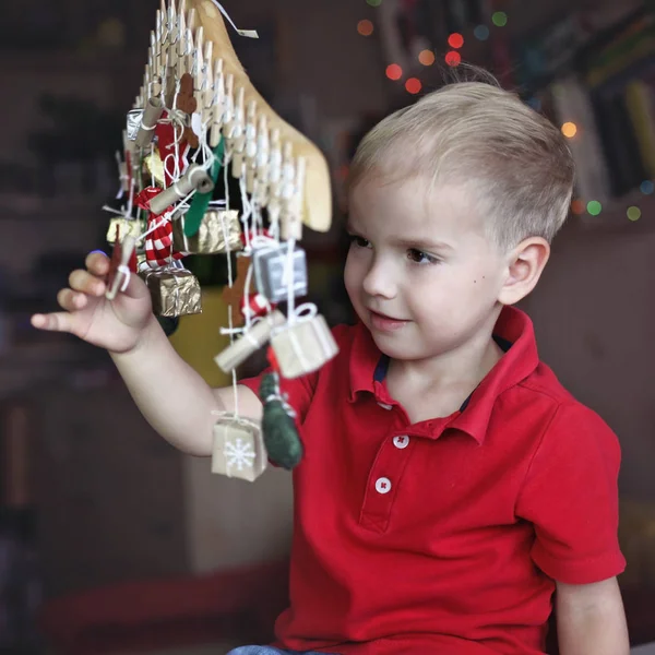 Cute Little Kid Stretching Advent Calendar Small Gifts Child Searching — Stock Photo, Image