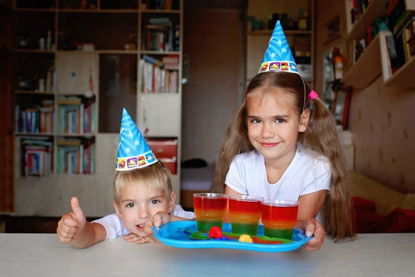 Happy sister and brother having fun at birthday party — Stock Photo, Image