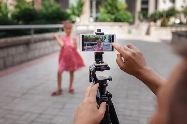 Make money online. Middle aged father and his daughter reviewing recorded film for family channel, video blogger, internet earning and freelance remote work