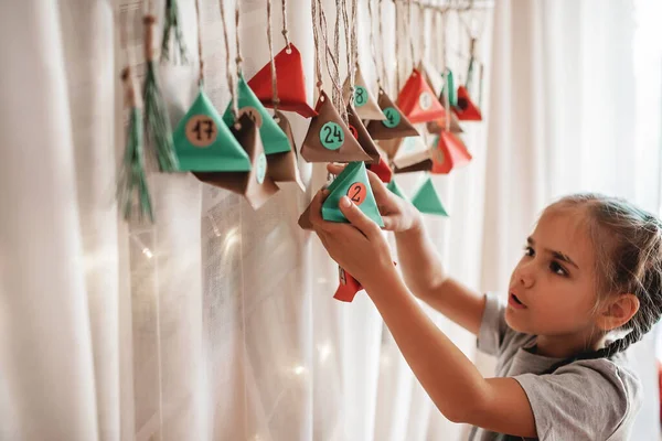 Cute Little Kid Opening Handmade Advent Calendar Color Paper Triangles — Stock Photo, Image