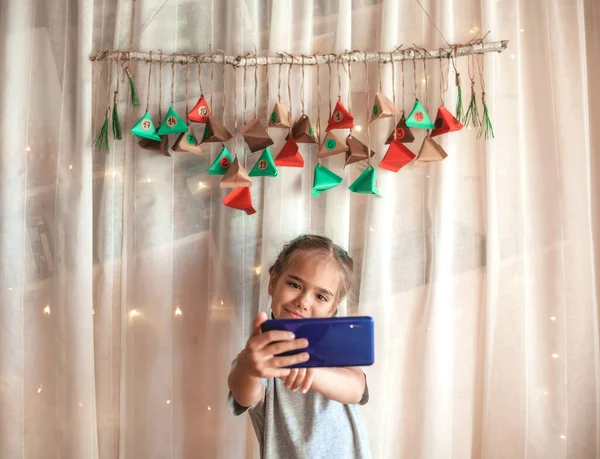 Cute Little Girl Making Selfie Handmade Advent Calendar Wall Home — Stock Photo, Image