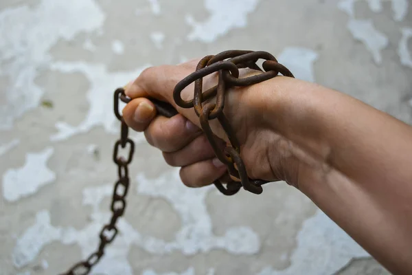 A womans hand wrapped in a chain — Stock Photo, Image
