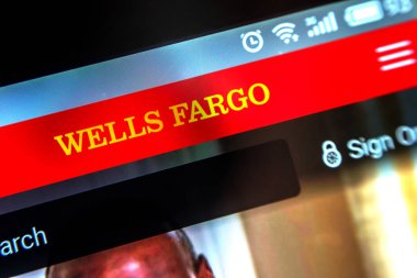 Berdyansk, Ukraine - March 31, 2019: Illustrative Editorial of Wells Fargo website homepage. Wells Fargo logo visible on the phone screen. clipart