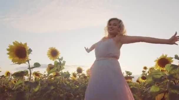A Young Woman Is Standing In A Field Among Sunflowers She Has