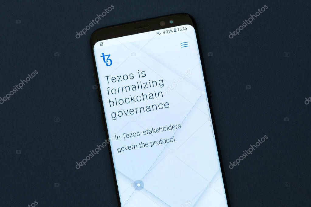 KYRENIA, CYPRUS -SEPTEMBER 12, 2018: Tezos website displayed on the smartphone screen. Tezos is a blockchain project that aims to offer the worlds first self-amending cryptocurrency