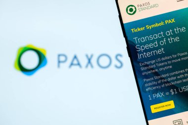 KYRENIA, CYPRUS  OCTOBER 8, 2018: Paxos Standart website displayed on the smartphone screen. PAX is cryptocurrency, stablecoin, completely regulated and approved by NYDFS clipart