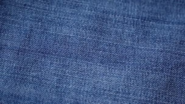 Blue denim jeans texture. Jeans background. Top view. — Stock Video