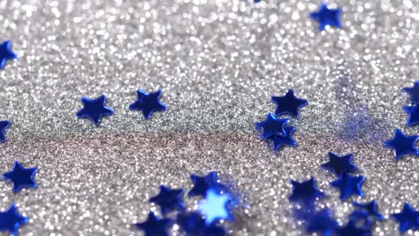 스타의 모양에서의 눈부신 반짝임 은색 배경에 클로즈업 — 비디오