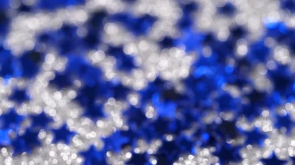 Sparkling glitter in the shape of a star. Close-up on a silver background — Stock Video