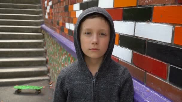 Portrait of a boy against a wall — Stock Video