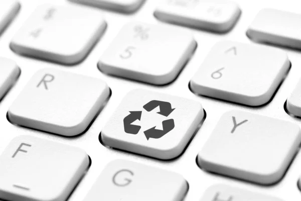 Recycle icon on computer keyboard for green and eco concept