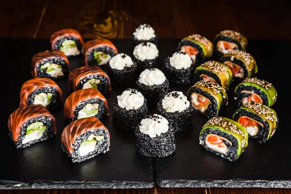 dishes of Japanese cuisine rolls with fish