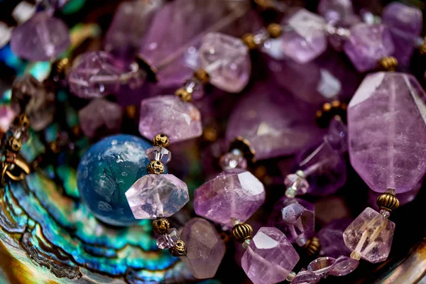 Purple beads made of natural stone .Macro. — Stock Photo, Image