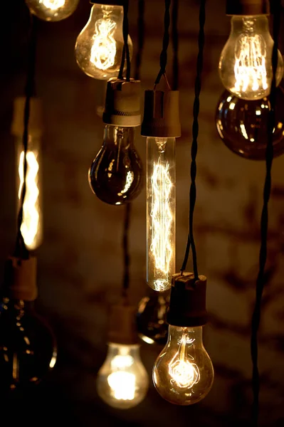 Bulbs Erickson suspended with the cells with the decoration bird.Yellow warm lamp light — Stock Photo, Image