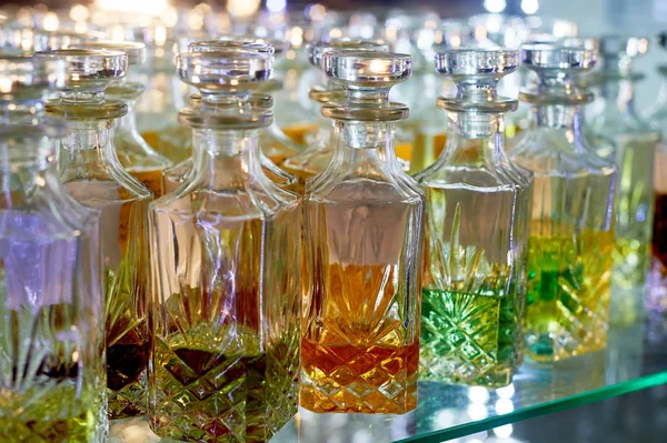 Glass perfume bottles based oils.A Bazaar, market.Aroma oils, oil perfume in faceted glass vessels.