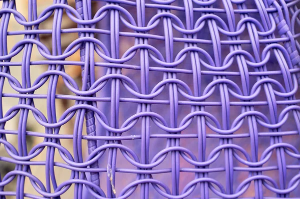 The texture of a wicker chair made of plastic. Processing. Purple — Stock Photo, Image