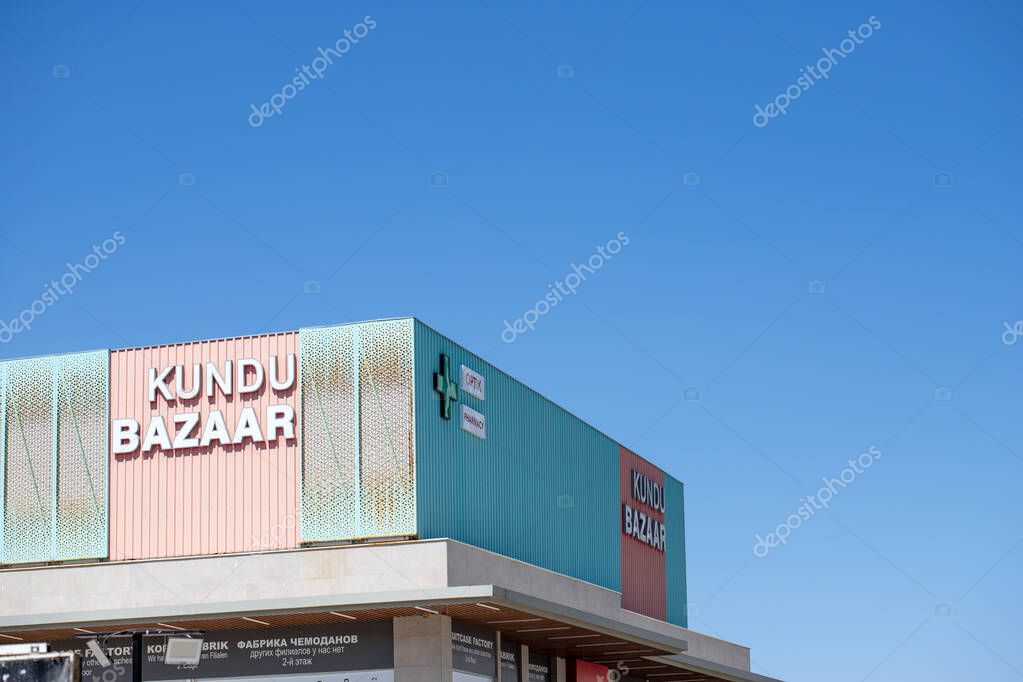A low-angle shot reveals a commercial building featuring 