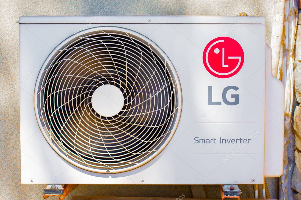Close-up of an LG air conditioner outdoor unit, showing the fan, housing, logo, and the 