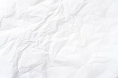 Üst görünüm ve buruşmuş beyaz kağıt dokusu dekoratif sanat eserlerinde buruşmuş beyaz kağıt arkaplan dokusu olarak kullanılır..