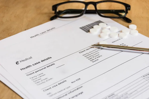 Medical examination paper on wooden background.