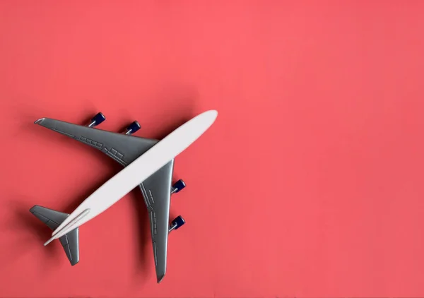 Model plane on pastel color background. Toy airplane.