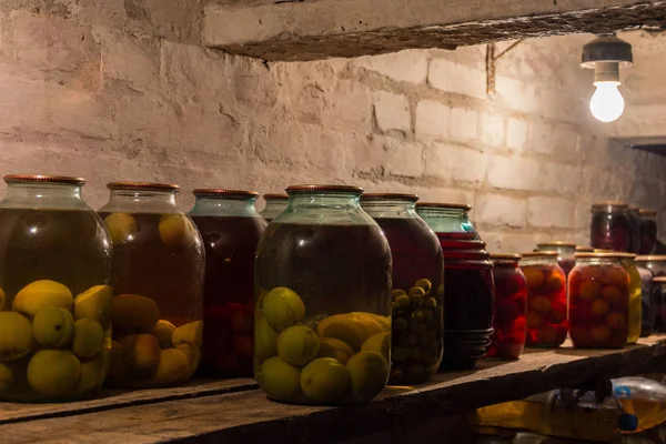 Cellar,plums,apples,grape in a jar,sweet juice — Stock Image Cellar,plums,apples,grape in a jar,sweet juice Royalty Free Stock Images