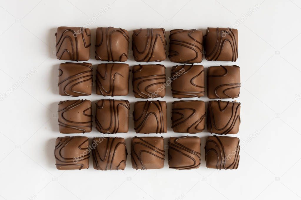 Chocolate candy on white background.