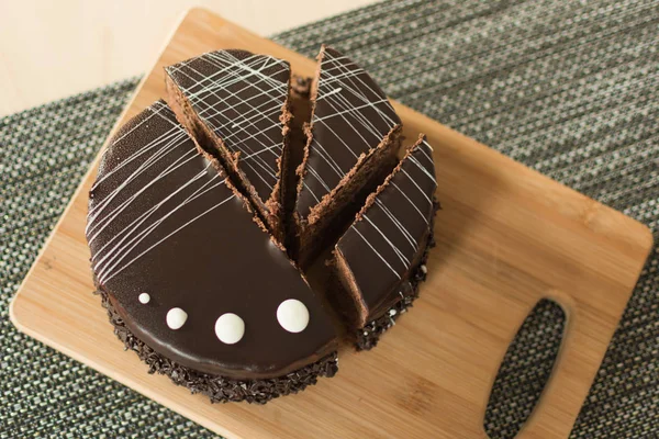 Chocolate cut cake top view.